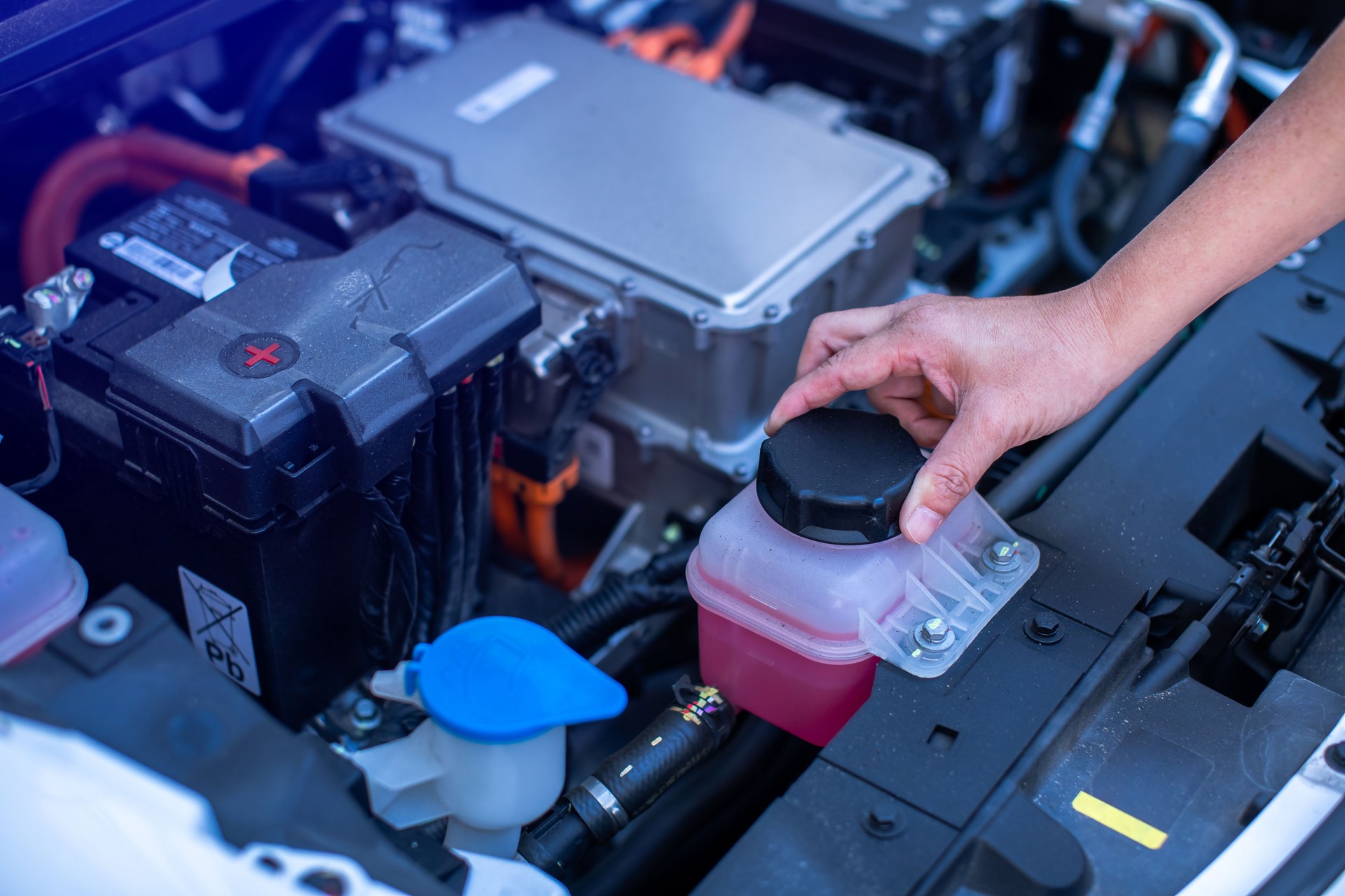 EV engine car engine block under hood electric vehicle high power and environmentally friendly zero emission. Chassis of the electric car with powertrain and power connection.